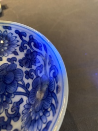 A pair of Chinese blue and white 'lotus scroll' stem cups, Kangxi