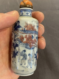 A Chinese blue, white and copper-red snuff bottle, 19th C.