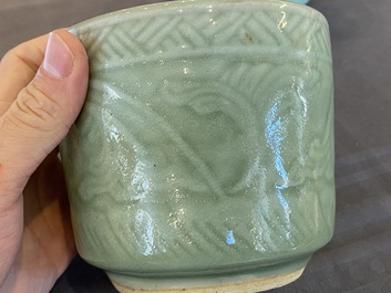 Two Chinese celadon-glazed brush pots with underglaze design, 19th C.