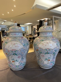 A pair of fine Chinese famille rose vases and covers, Qianlong mark, 19th C.