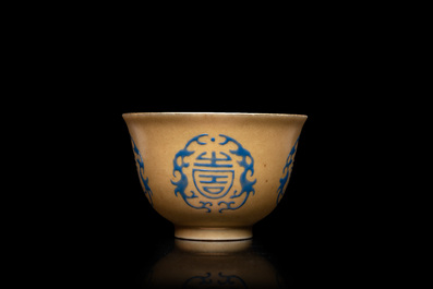 A Chinese blue enamel on gilt &lsquo;Shou&rsquo; tea bowl, 18/19th C.