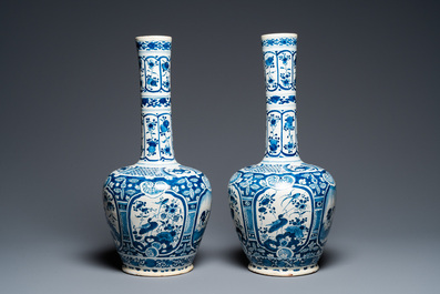 A pair of Dutch Delft blue and white chinoiserie bottle vases, 18th C.