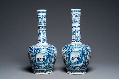 A pair of Dutch Delft blue and white chinoiserie bottle vases, 18th C.