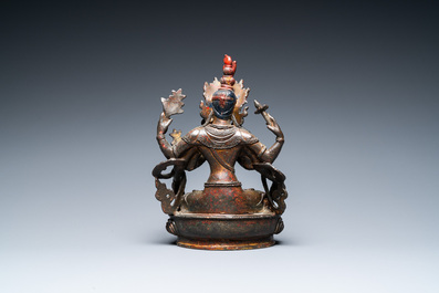 A Sino-Tibetan gilt-lacquered bronze Vasudhara, 17th C.