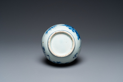 A Chinese blue and white bottle vase with floral design, Transitional period