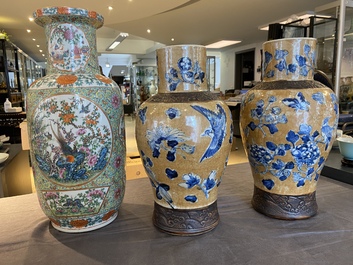 A Chinese Canton famille rose rouleau vase and a pair of Nanking vases, 19th C.