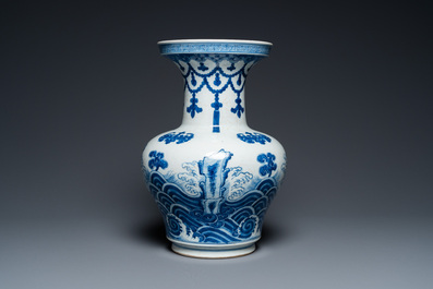 A Chinese blue and white vase with rocks in a wavy sea, Qianlong/Jiaqing