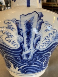 A Chinese blue and white vase with rocks in a wavy sea, Qianlong/Jiaqing