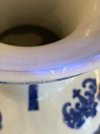 A Chinese blue and white vase with rocks in a wavy sea, Qianlong/Jiaqing