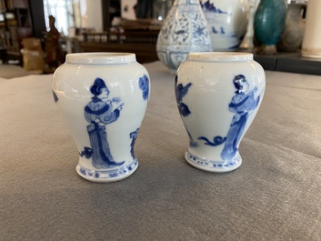 A pair of Chinese blue and white small vases with ladies, Kangxi