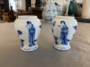 A pair of Chinese blue and white small vases with ladies, Kangxi