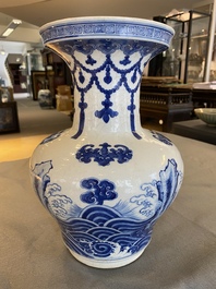 A Chinese blue and white vase with rocks in a wavy sea, Qianlong/Jiaqing