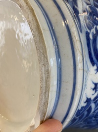 A Chinese blue and white vase with rocks in a wavy sea, Qianlong/Jiaqing