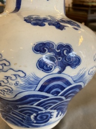 A Chinese blue and white vase with rocks in a wavy sea, Qianlong/Jiaqing