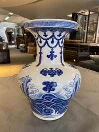 A Chinese blue and white vase with rocks in a wavy sea, Qianlong/Jiaqing