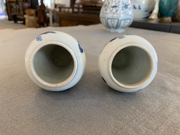 A pair of Chinese blue and white small vases with ladies, Kangxi