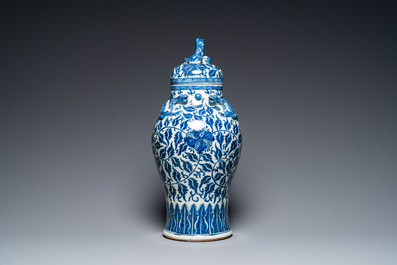 A pair of Chinese famille verte double gourd vases and a blue and white vase and cover, 19/20th C.