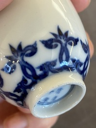 A Chinese blue and white cup with floral design, Kangxi mark, 19/20th C.