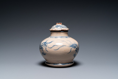 A Vietnamese blue and white Bat Trang stoneware 'dragon' jar and cover, 19/20th C.