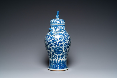 A pair of Chinese famille verte double gourd vases and a blue and white vase and cover, 19/20th C.