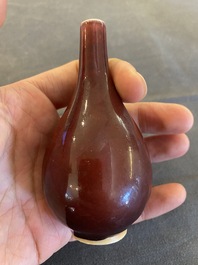 A small Chinese sang-de-boeuf-glazed bottle vase, Xuande mark, Qing