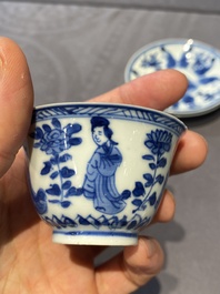 A Chinese blue and white bowl and a pair of cups and saucers, Kangxi