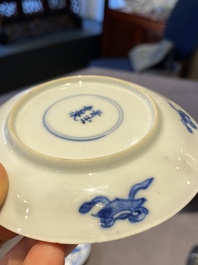 A Chinese blue and white bowl and a pair of cups and saucers, Kangxi