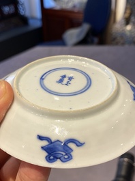 A Chinese blue and white bowl and a pair of cups and saucers, Kangxi