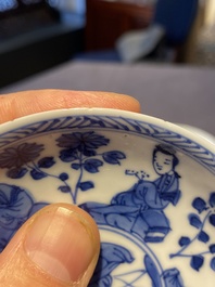 A Chinese blue and white bowl and a pair of cups and saucers, Kangxi