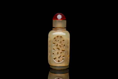 A Chinese reticulated and movable celadon jade snuff bottle, Qing