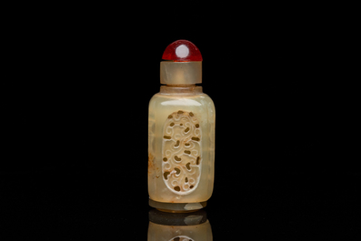 A Chinese reticulated and movable celadon jade snuff bottle, Qing