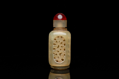 A Chinese reticulated and movable celadon jade snuff bottle, Qing