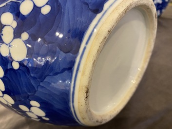 A pair of Chinese blue and white jars and covers, 19th C.