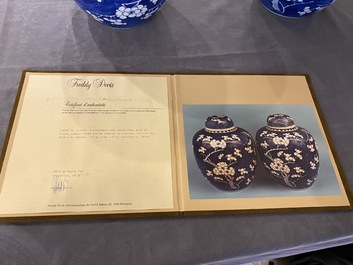 A pair of Chinese blue and white jars and covers, 19th C.