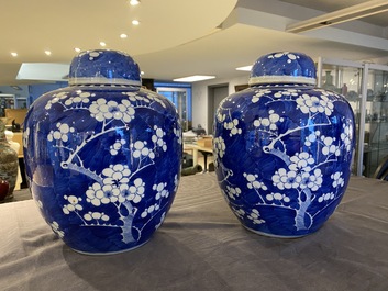 A pair of Chinese blue and white jars and covers, 19th C.