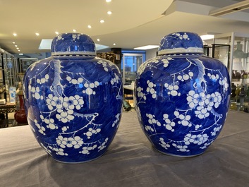 A pair of Chinese blue and white jars and covers, 19th C.