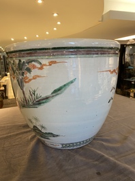 A Chinese famille verte fish bowl with female musicians in a garden, 19th C.