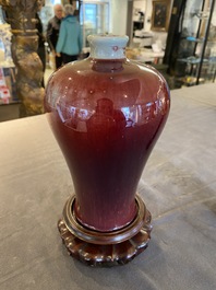 A Chinese peachbloom-glazed 'meiping' vase on wooden stand, 19th C.