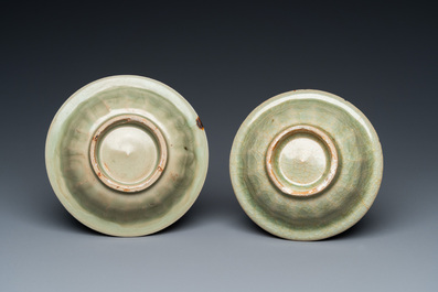 Two Chinese celadon-glazed bowls, one with twin fish, Ming