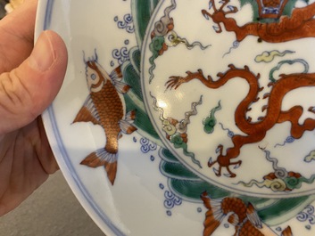 A pair of Chinese doucai 'dragon' plates, Chenghua mark, Kangxi