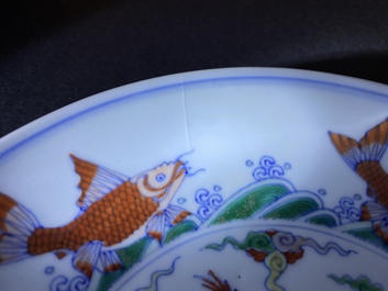 A pair of Chinese doucai 'dragon' plates, Chenghua mark, Kangxi