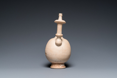A Chinese cream-white-glazed stoneware kundika, probably Tang