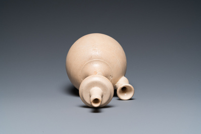 A Chinese cream-white-glazed stoneware kundika, probably Tang