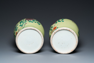 A pair of Chinese famille verte yellow-ground vases and covers, 19th C.