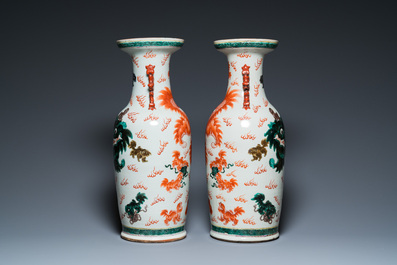 A pair of Chinese polychrome 'Buddhist lions' vases, 19th C.