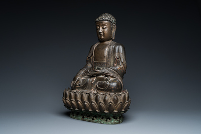 A large Sino-Tibetan gilt bronze Buddha on lotus throne, Ming