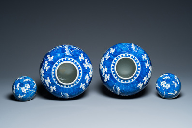 A pair of Chinese blue and white jars and covers, 19th C.