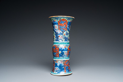 A Chinese blue and white 'gu' vase with European clobbered design, Kangxi