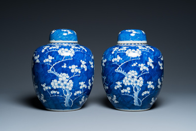 A pair of Chinese blue and white jars and covers, 19th C.