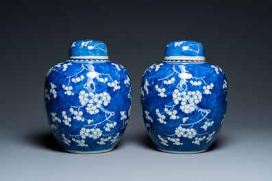 A pair of Chinese blue and white jars and covers, 19th C.